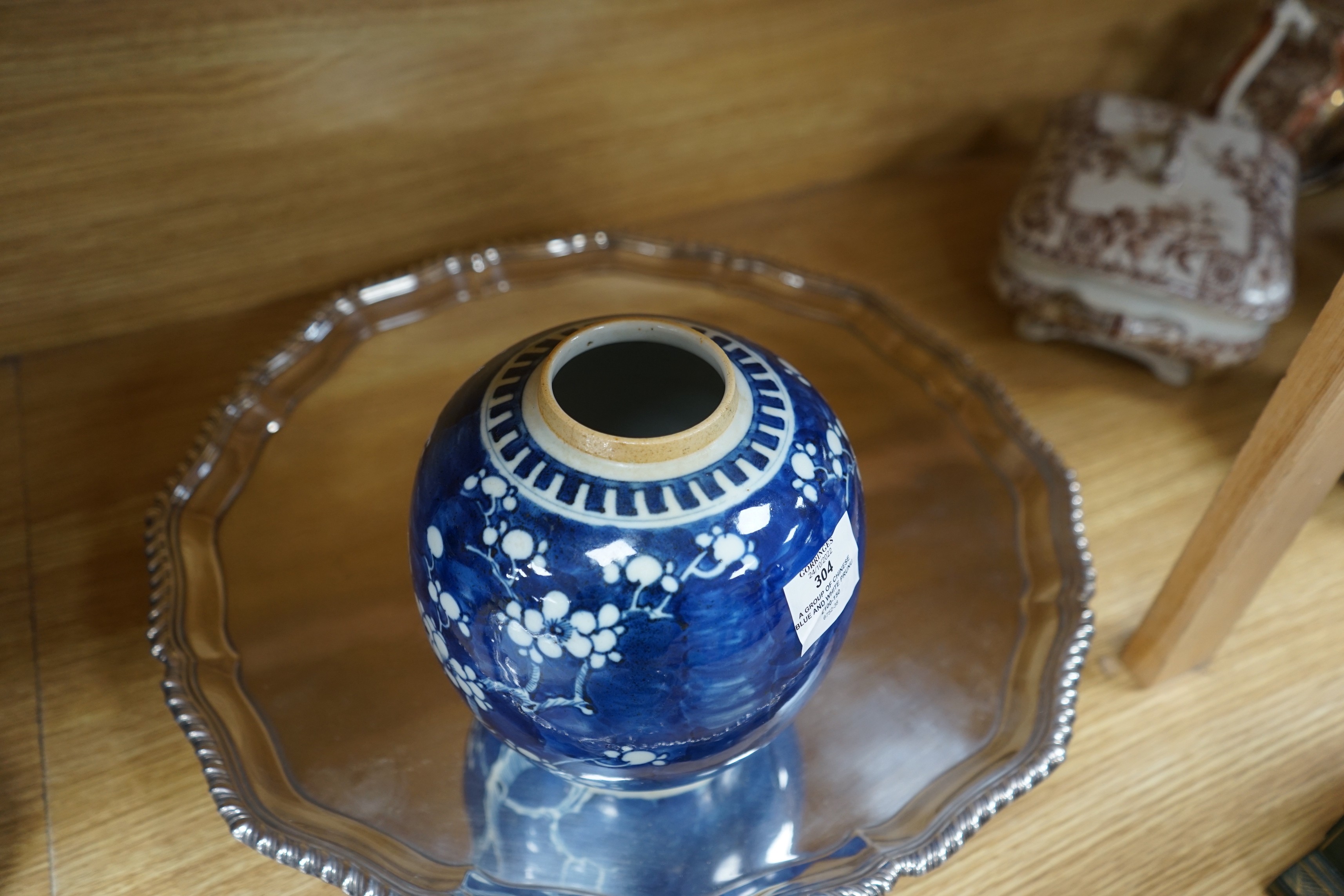 A group of Chinese blue and white prunus vases and jars and covers and jars, pair of vases 23 cms high